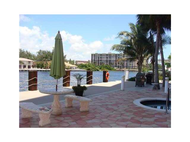 821 North Riverside Drive, Unit 903 Pompano Beach, FL 33062 - Photo 17 of 17 a view of a living room and kitchen