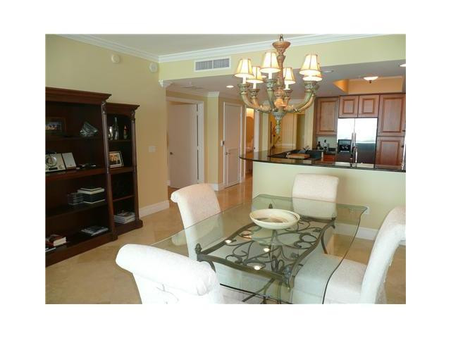 821 North Riverside Drive, Unit 903 Pompano Beach, FL 33062 - Photo 4 of 17 a living room with furniture and a chandelier