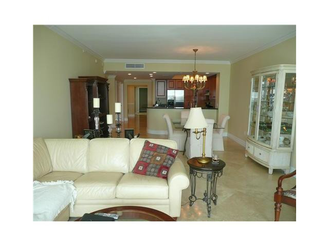 821 North Riverside Drive, Unit 903 Pompano Beach, FL 33062 - Photo 5 of 17 a living room with furniture and a large window