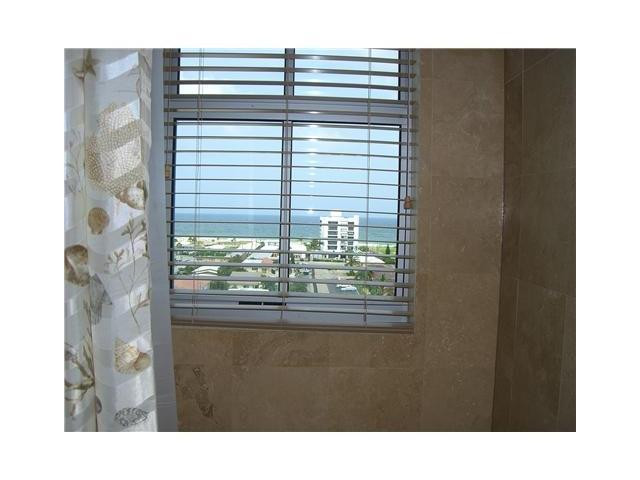 821 North Riverside Drive, Unit 903 Pompano Beach, FL 33062 - Photo 8 of 17 a bathroom with a sink and a mirror