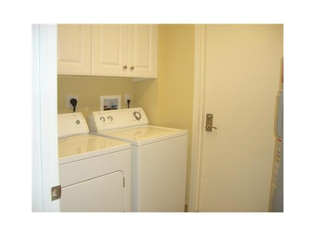 821 North Riverside Drive, Unit 903 Pompano Beach, FL 33062 - Photo 9 of 17 a utility room with dryer and washer