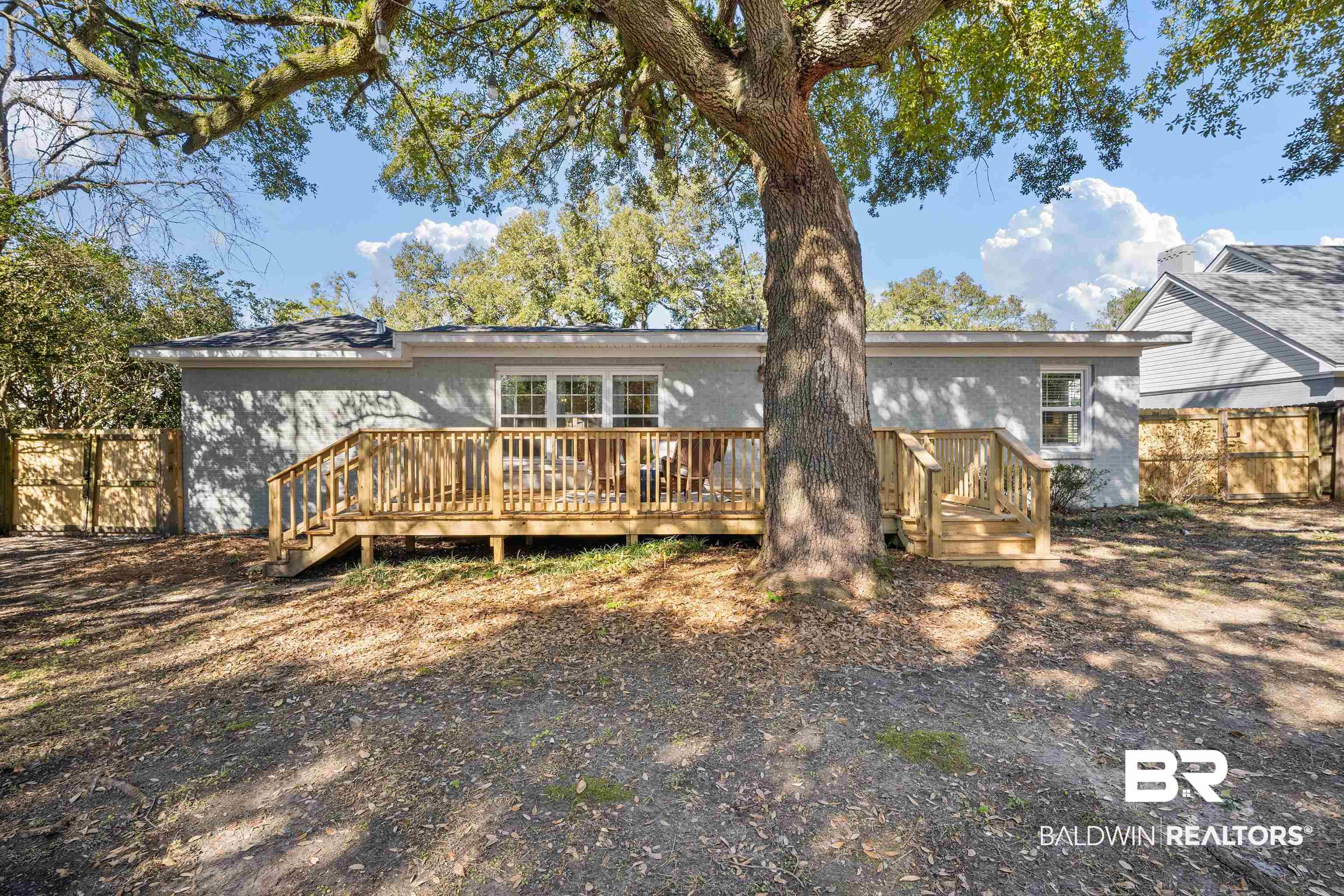 2615 Walton Avenue Mobile, AL 36606 - Photo 31 of 33 Back of property with a deck and fence