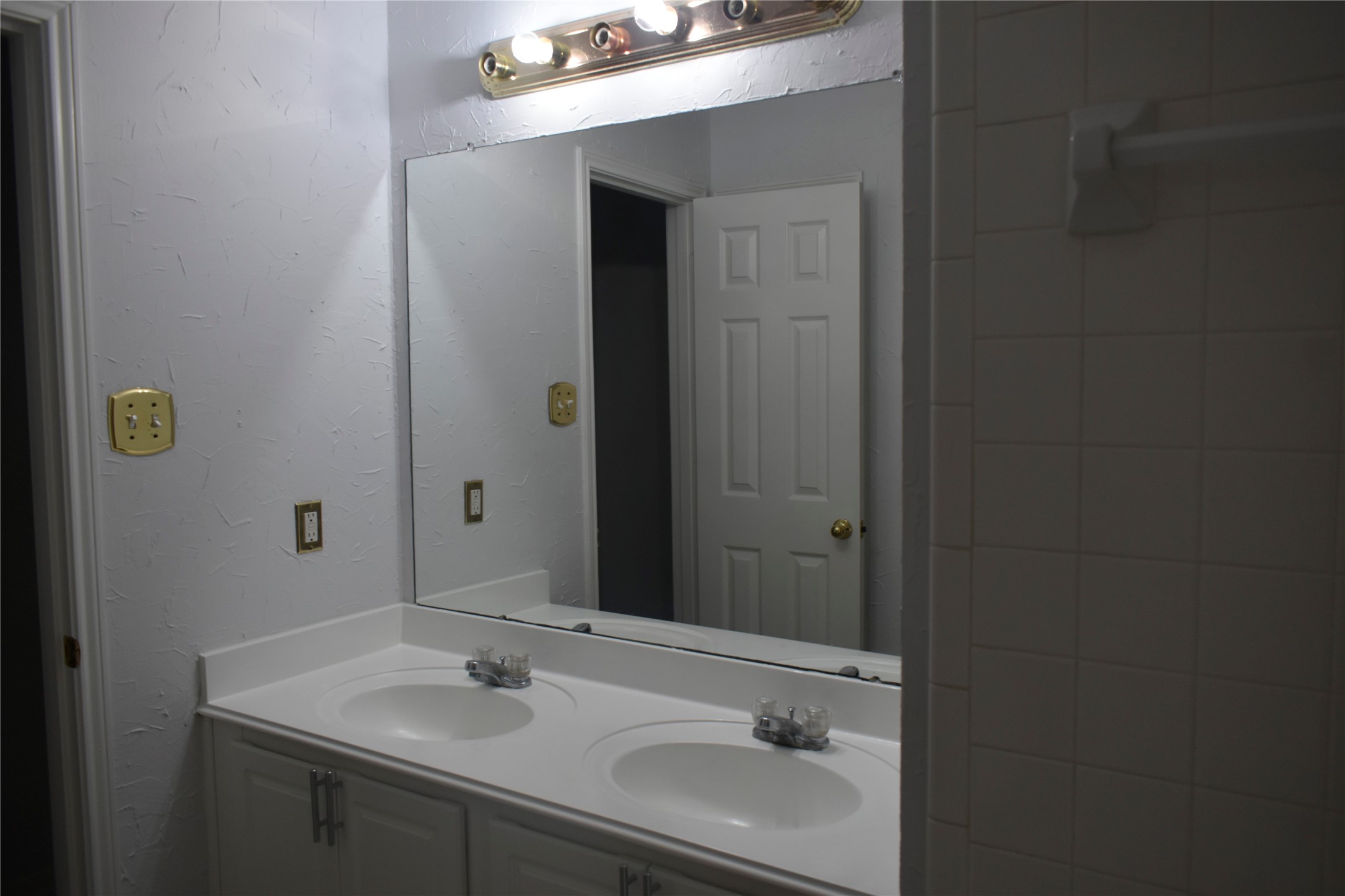 507 Springhope Court Houston, TX 77049 - Photo 11 of 18 a bathroom with a sink and a mirror