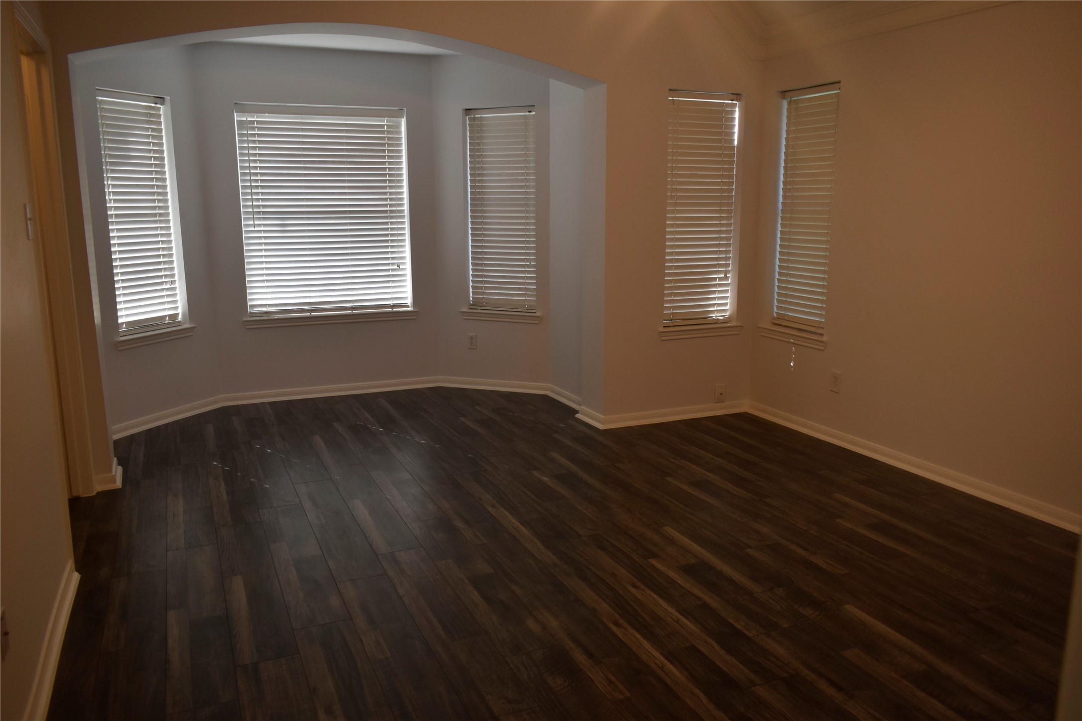 507 Springhope Court Houston, TX 77049 - Photo 13 of 18 a view of wooden floor and windows in a room