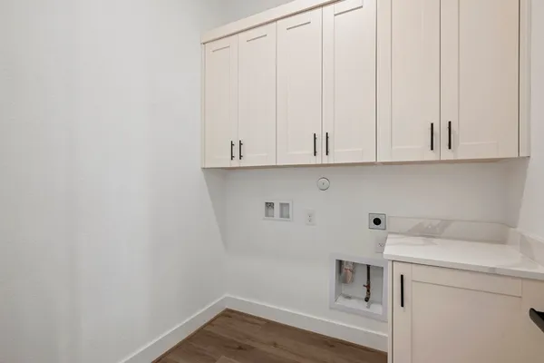 a view of cabinets with wooden floor