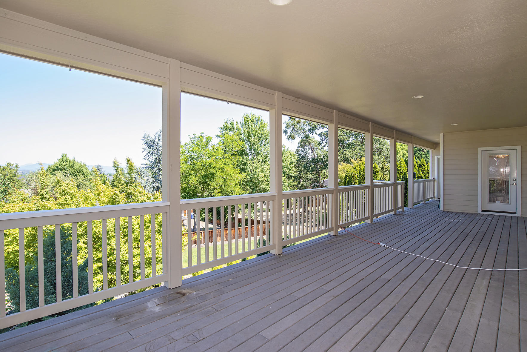 449 Quail Run Eagle Point, OR 97524 - Photo 31 of 35 a view of a wooden deck next to a yard
