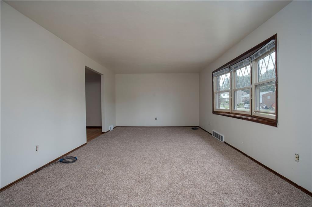 857 Blue Ridge Road Pittsburgh, PA 15239 - Photo 3 of 21 Spacious formal living room with all new carpeting...