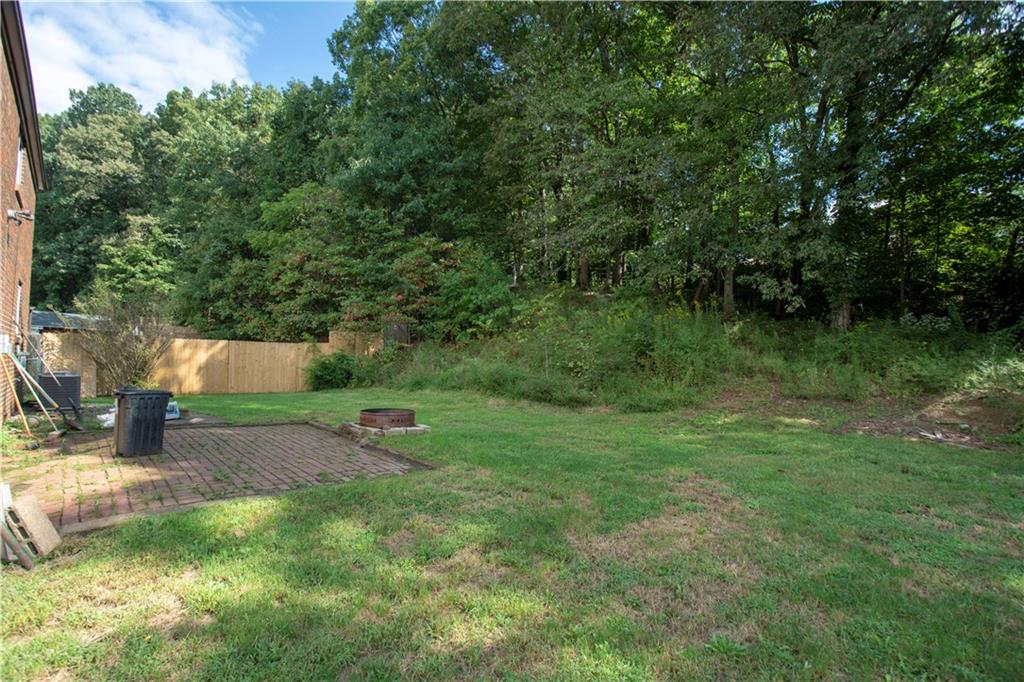 857 Blue Ridge Road Pittsburgh, PA 15239 - Photo 21 of 21 Yard with wooded area ...