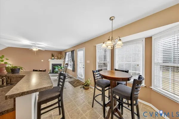 a kitchen with stainless steel appliances granite countertop a sink refrigerator stove and microwave