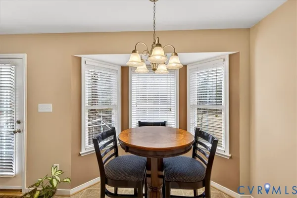 a kitchen with granite countertop a sink and a window