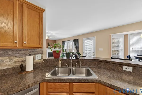 a kitchen with a sink and cabinets