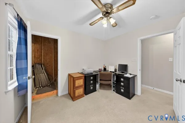 a spacious bedroom with a bed and a window