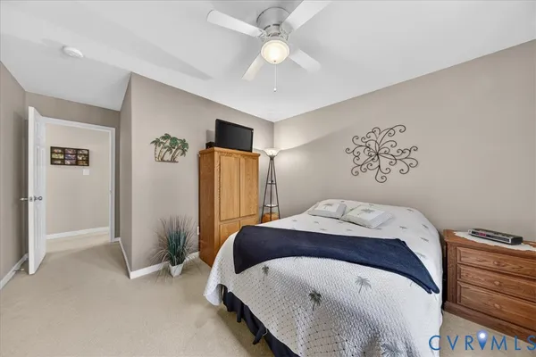 a bedroom with furniture and a chandelier