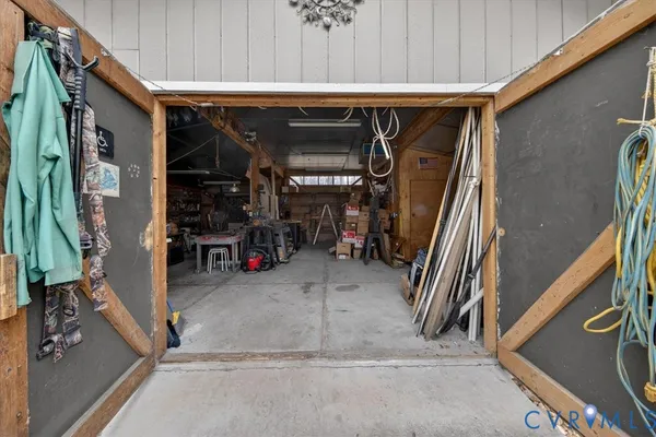 a backyard of a house with a large tree and yard