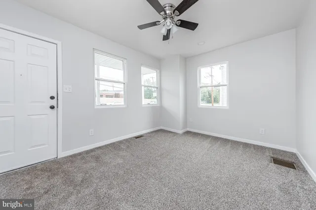 a view of an empty room with a window