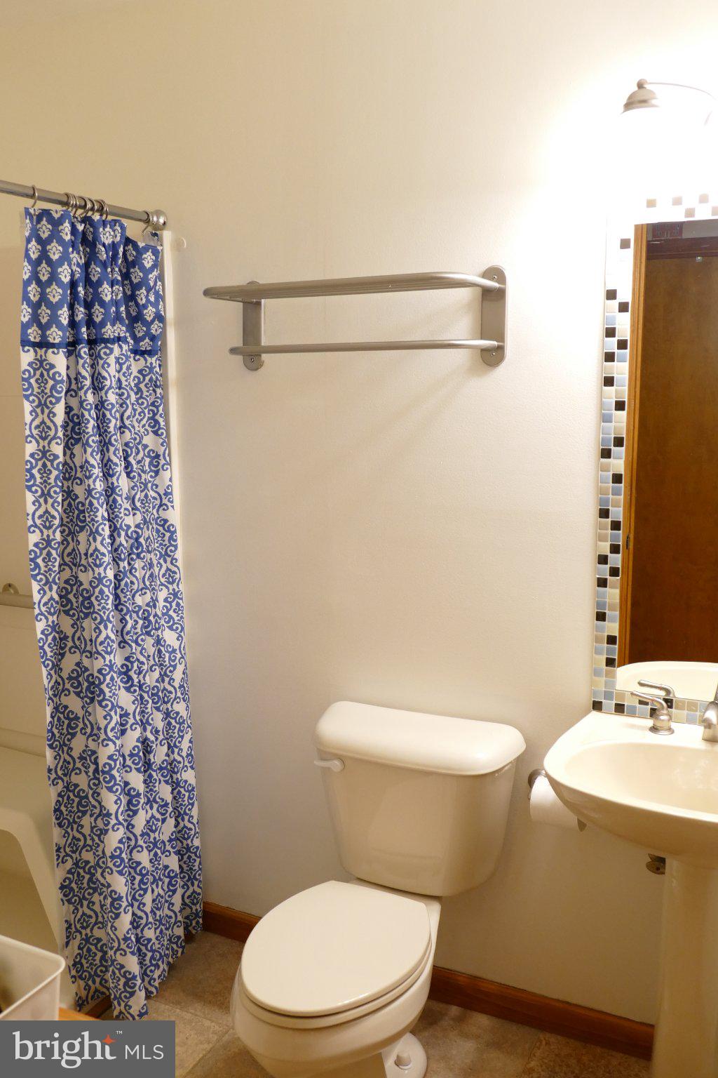 185 Windjammer Road Ocean Pines, MD 21811 - Photo 15 of 18 Charming bathroom with blue accents.