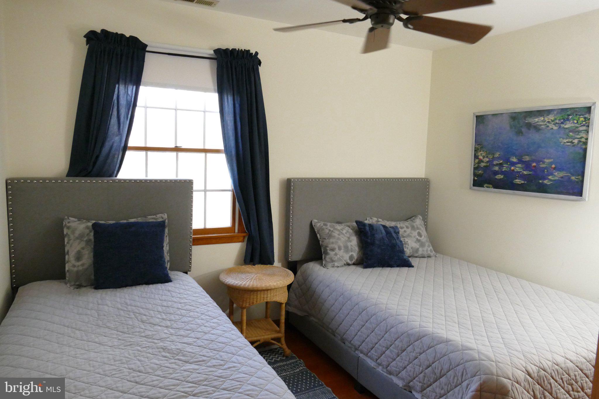 185 Windjammer Road Ocean Pines, MD 21811 - Photo 16 of 18 Cozy twin bedroom with serene decor.