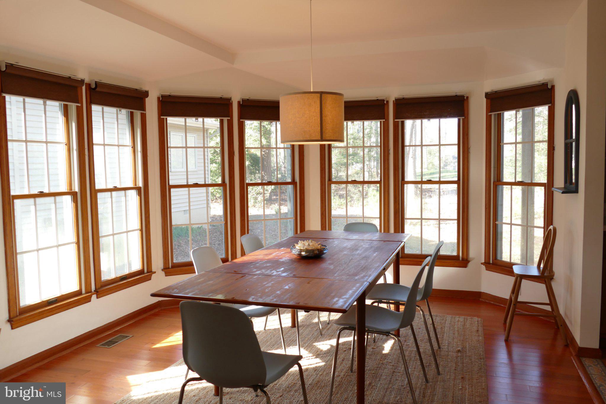 185 Windjammer Road Ocean Pines, MD 21811 - Photo 5 of 18 Sunlit dining space with bay windows.