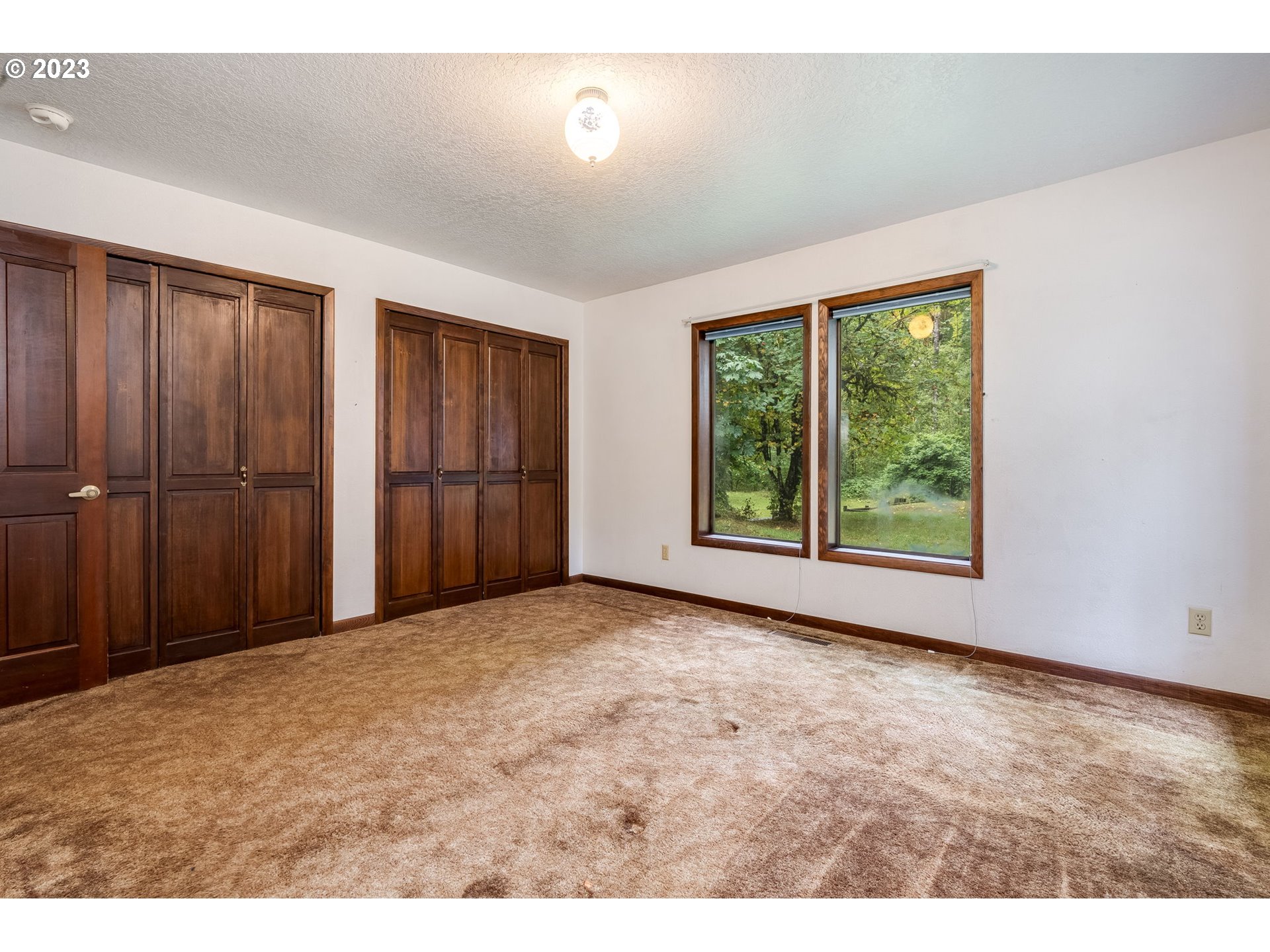 13721 Southeast Bluff Road Sandy, OR 97055 - Photo 13 of 46 a view of an empty room with a window