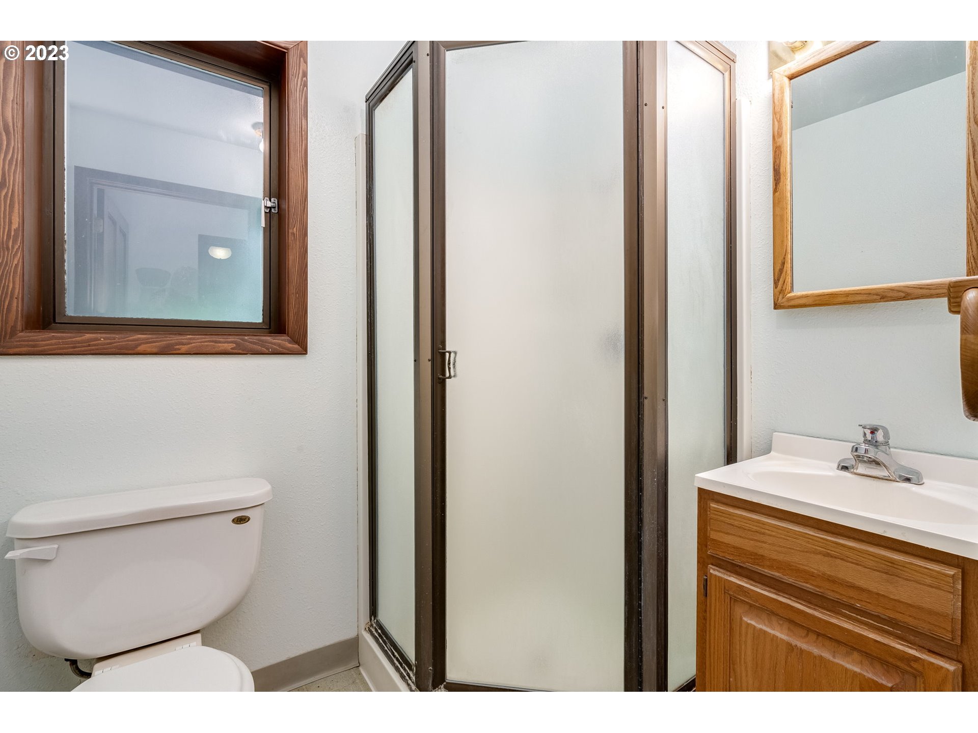 13721 Southeast Bluff Road Sandy, OR 97055 - Photo 19 of 46 a bathroom with a sink a toilet and a mirror