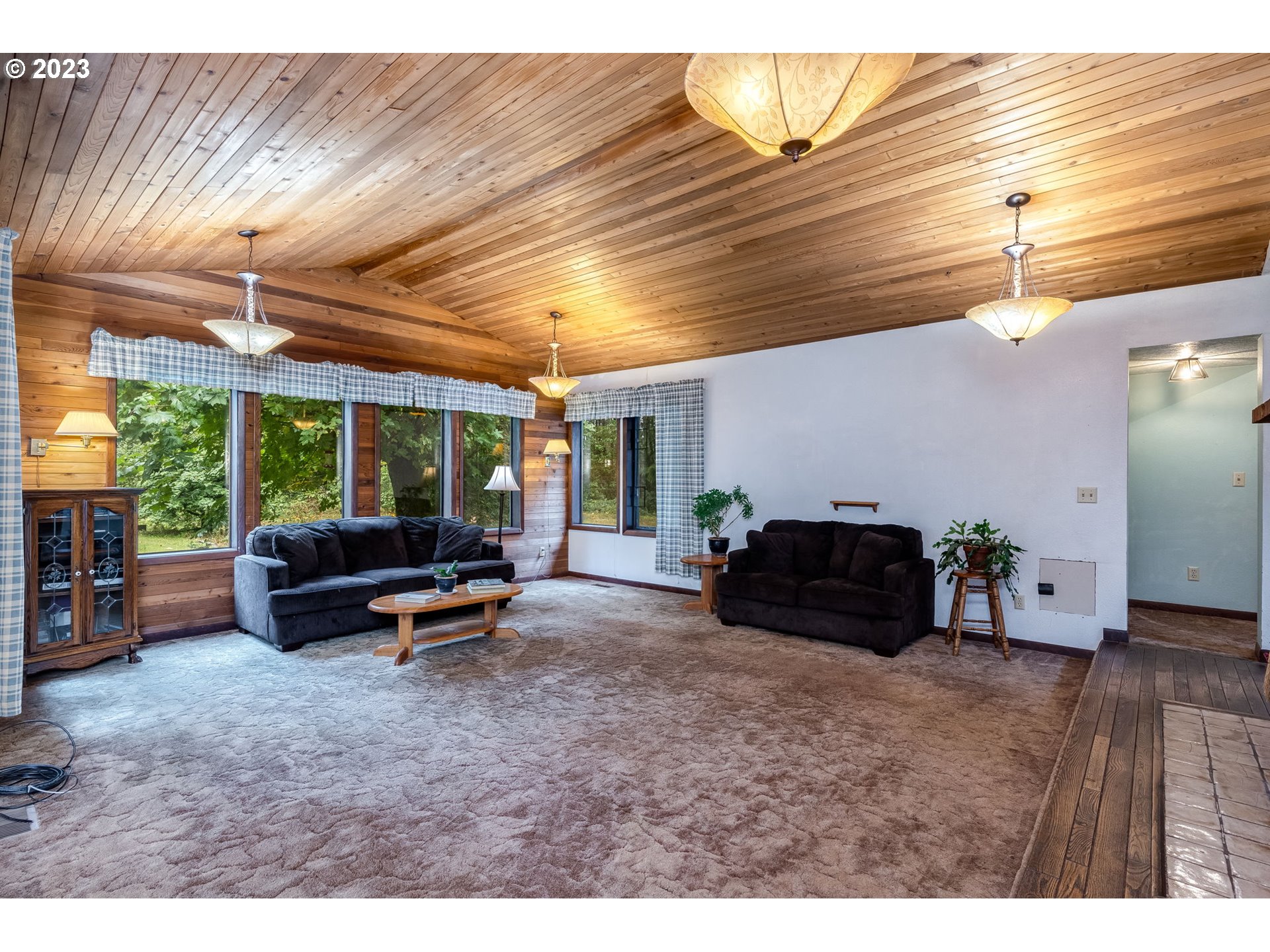 13721 Southeast Bluff Road Sandy, OR 97055 - Photo 3 of 46 a living room with furniture and a wooden floor