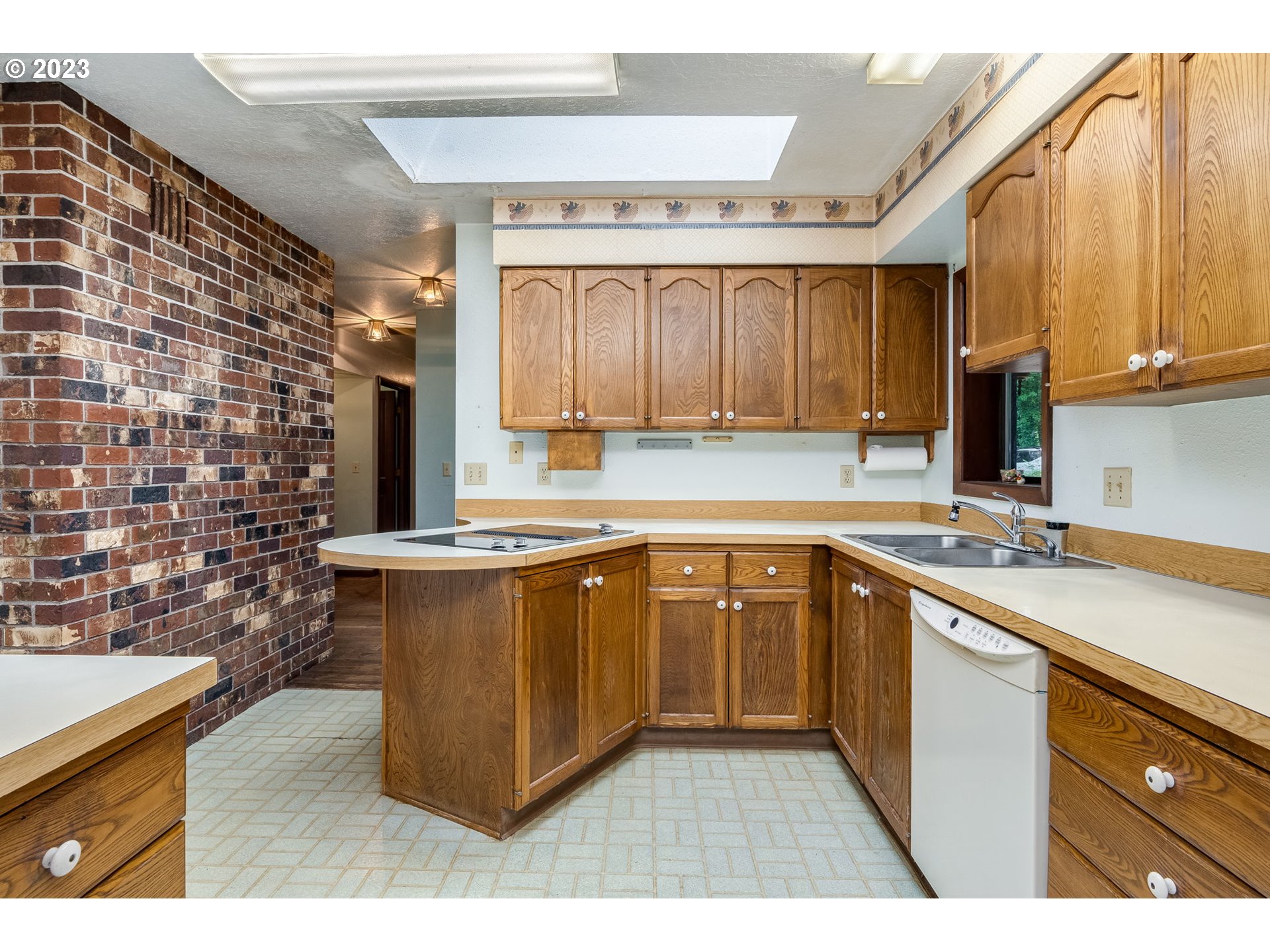 13721 Southeast Bluff Road Sandy, OR 97055 - Photo 8 of 46 a kitchen with stainless steel appliances granite countertop a sink stove and cabinets