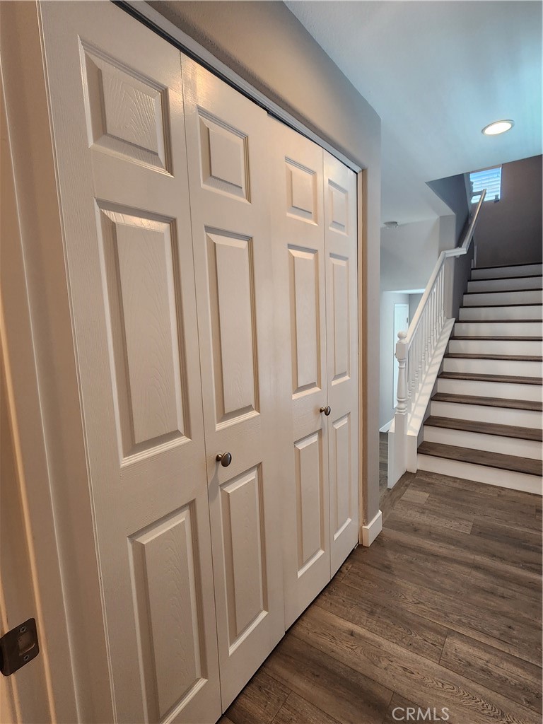 1 Arabis Way, Unit 59 Ladera Ranch, CA 92694 - Photo 17 of 32 a view of a hallway with wooden floor and entryway