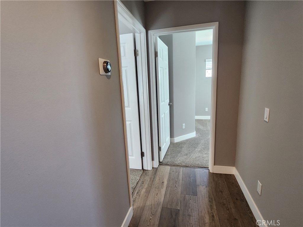 1 Arabis Way, Unit 59 Ladera Ranch, CA 92694 - Photo 20 of 32 a view of a hallway with wooden floor