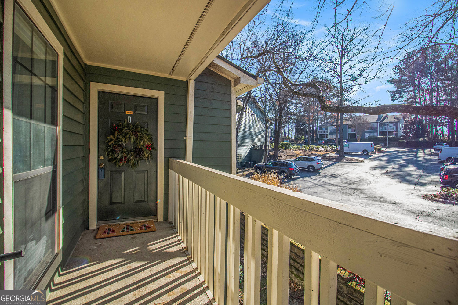 a view of a house with a bench in front of house