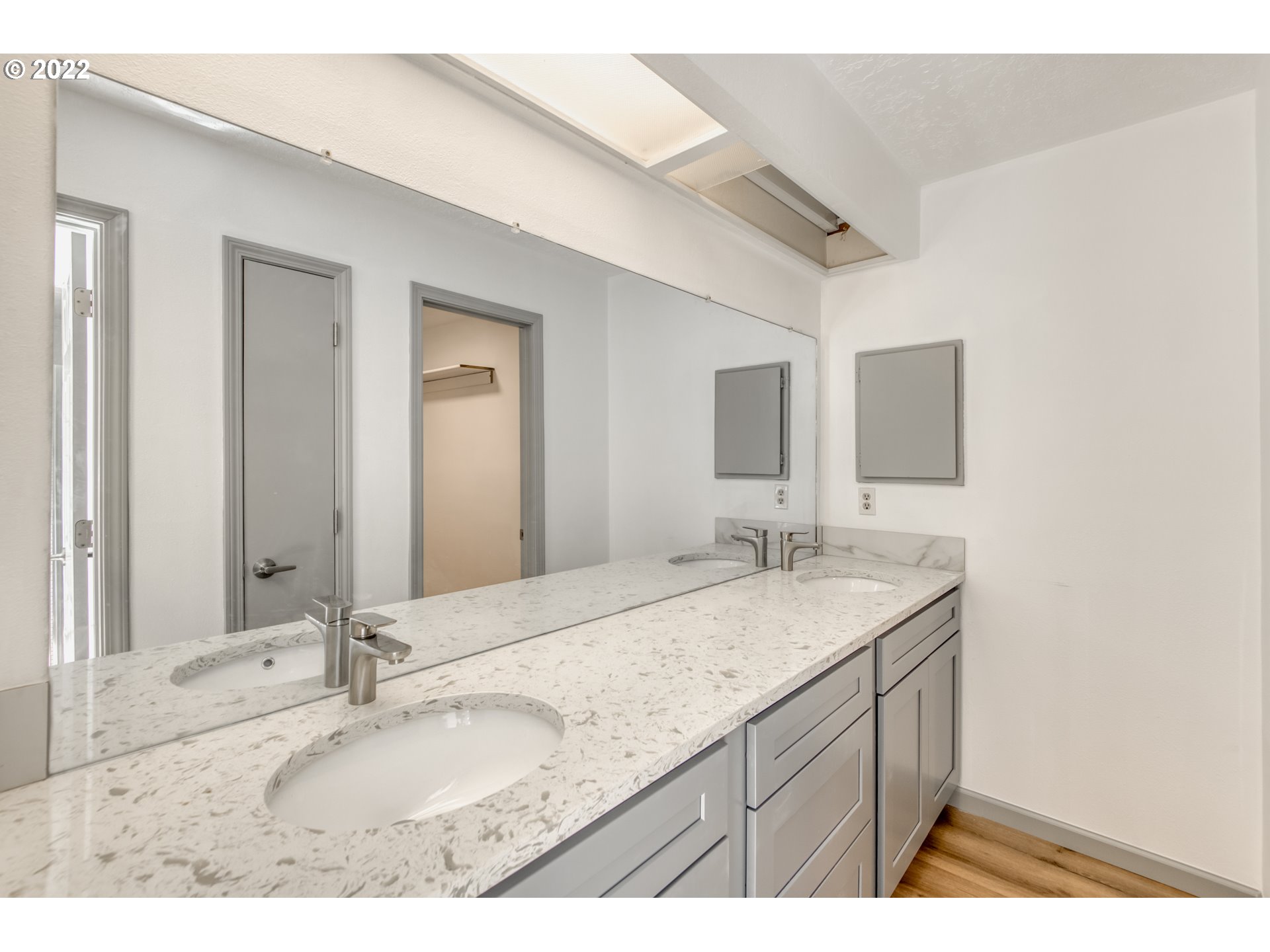 4435 Southeast Regner Road Gresham, OR 97080 - Photo 21 of 32 a bathroom with a granite countertop sink and a mirror