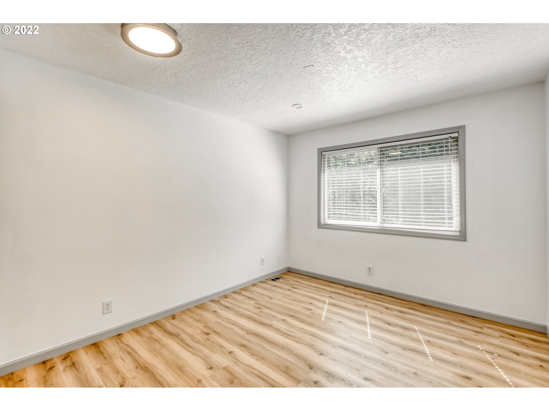 4435 Southeast Regner Road Gresham, OR 97080 - Photo 24 of 32 a view of an empty room with a window