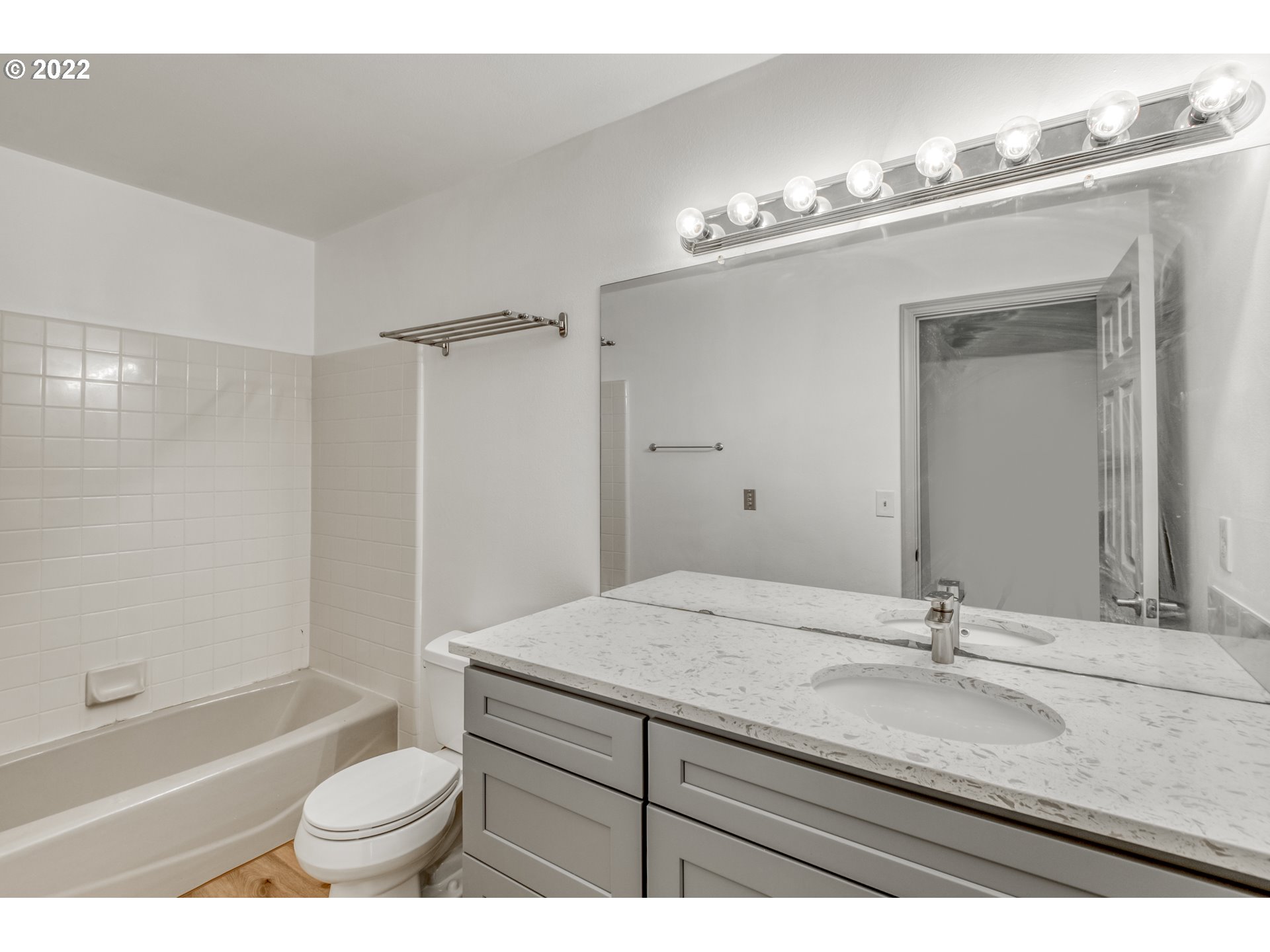 4435 Southeast Regner Road Gresham, OR 97080 - Photo 26 of 32 a bathroom with a sink a toilet and a bathtub