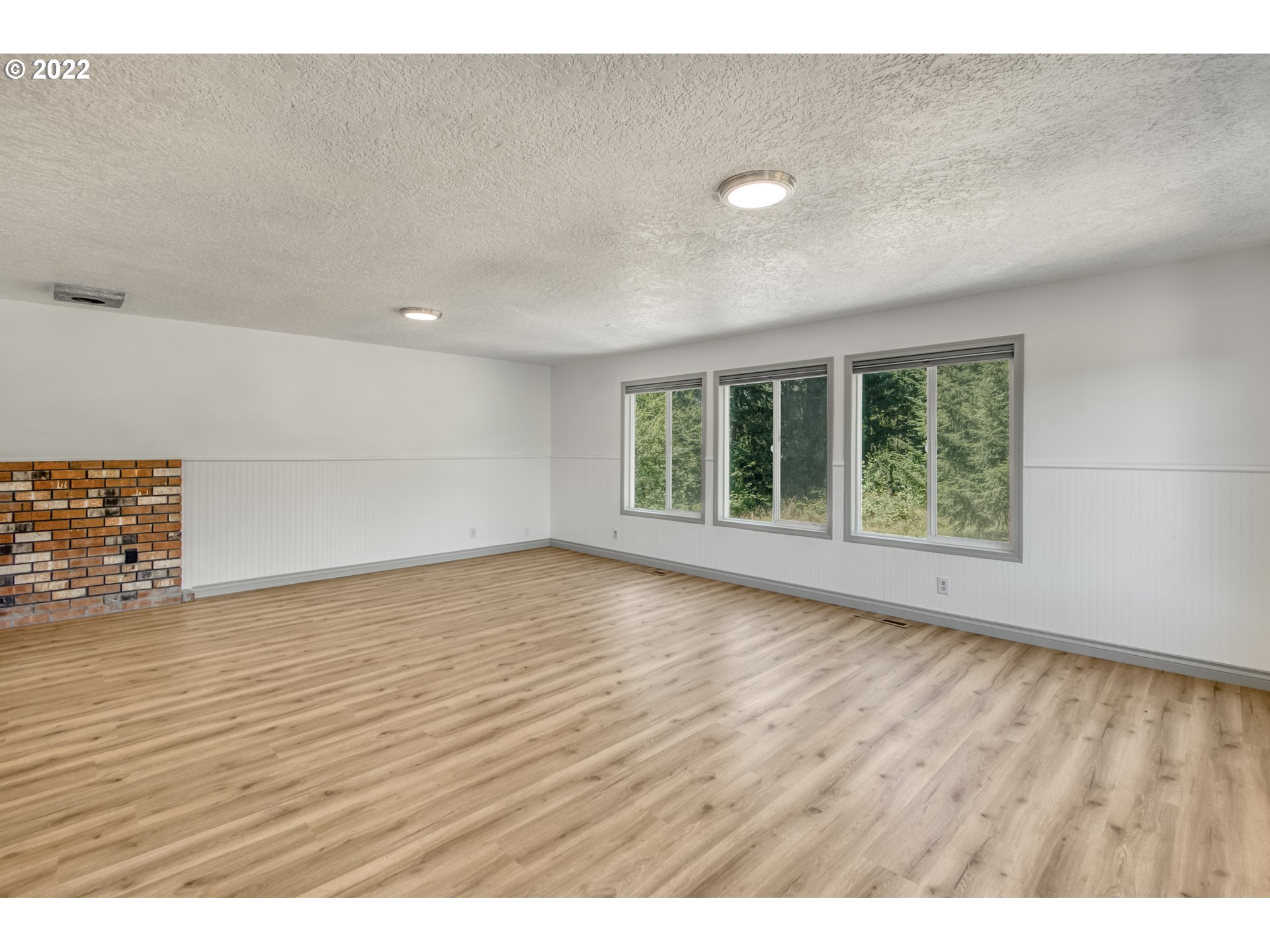 4435 Southeast Regner Road Gresham, OR 97080 - Photo 27 of 32 wooden floor in an empty room with a window