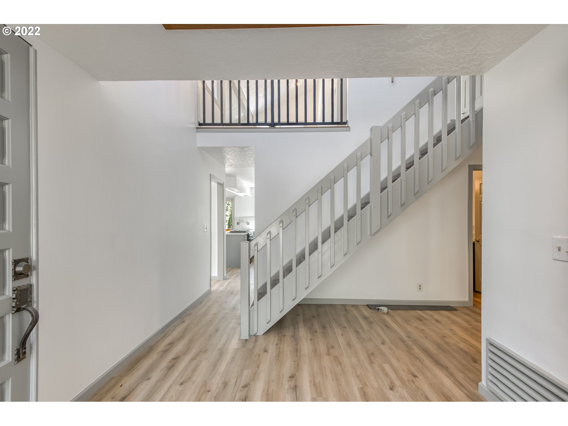 4435 Southeast Regner Road Gresham, OR 97080 - Photo 6 of 32 a view of entryway and hall with wooden floor