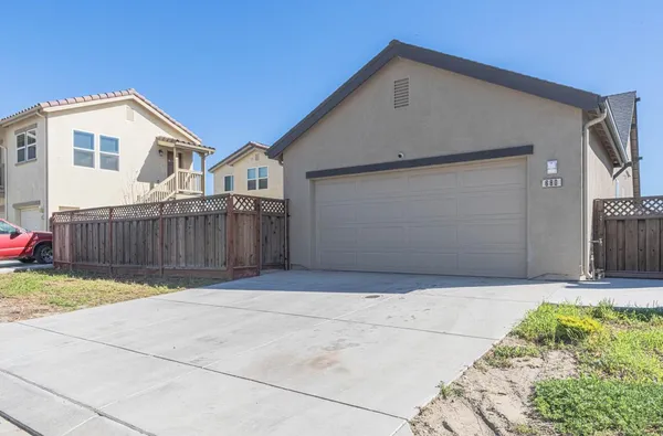 a front view of a house with a garage