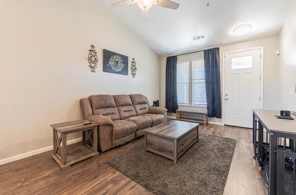 a living room with furniture and a window