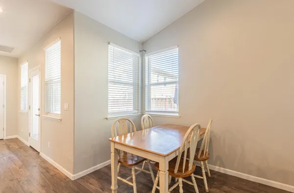 a view of a dining room with furniture and window