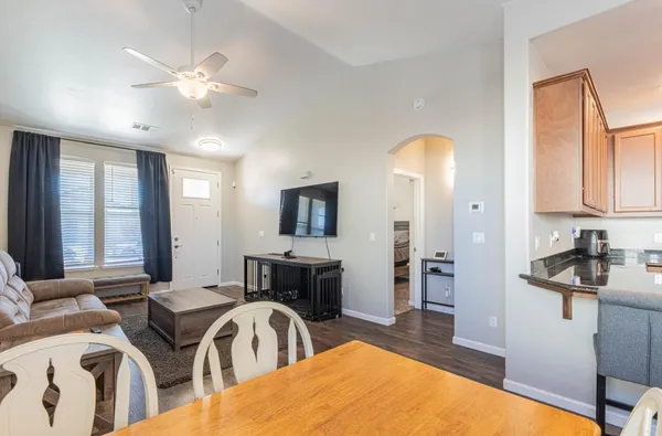 a view of a livingroom with furniture and chandelier