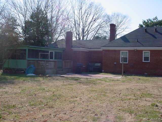 5207 Coxson Road Sandston, VA 23150 - Photo 3 of 5 a house with trees in front of it