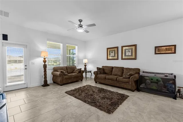 a living room with furniture and a window