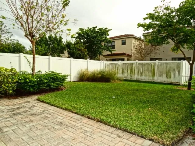 a view of a back yard of the house