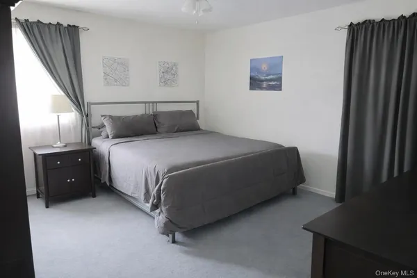 a utility room with cabinets washer and dryer