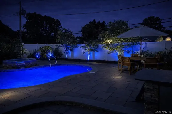 a kitchen with granite countertop a refrigerator stove top oven and sink