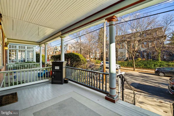 a view of a porch with wooden floor