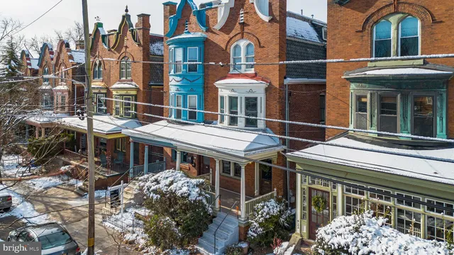 a front view of a residential apartment building with a yard