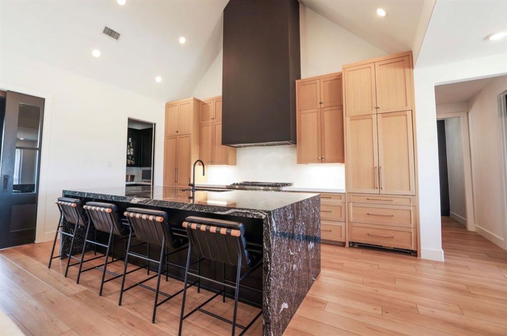 6724 Clearwater Ranch Road Wills Point, TX 75169 - Photo 11 of 38 a kitchen with a table chairs sink and cabinets