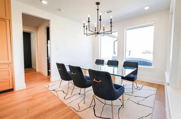 a bedroom with a bed and a mirror