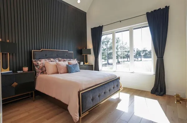 a view of a porch with a floor to ceiling window and a yard