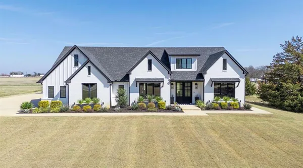 a living room with furniture and a large mirror