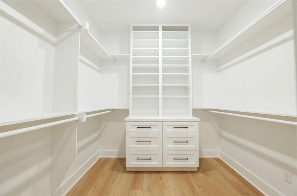 6724 Clearwater Ranch Road Wills Point, TX 75169 - Photo 31 of 38 a view of walk in closet with empty racks